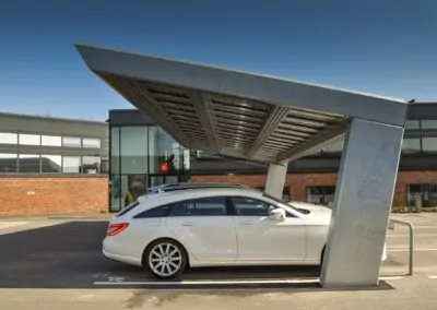 Solar carport featuring energy-efficient solar panels, providing shade and renewable energy for parked vehicles.