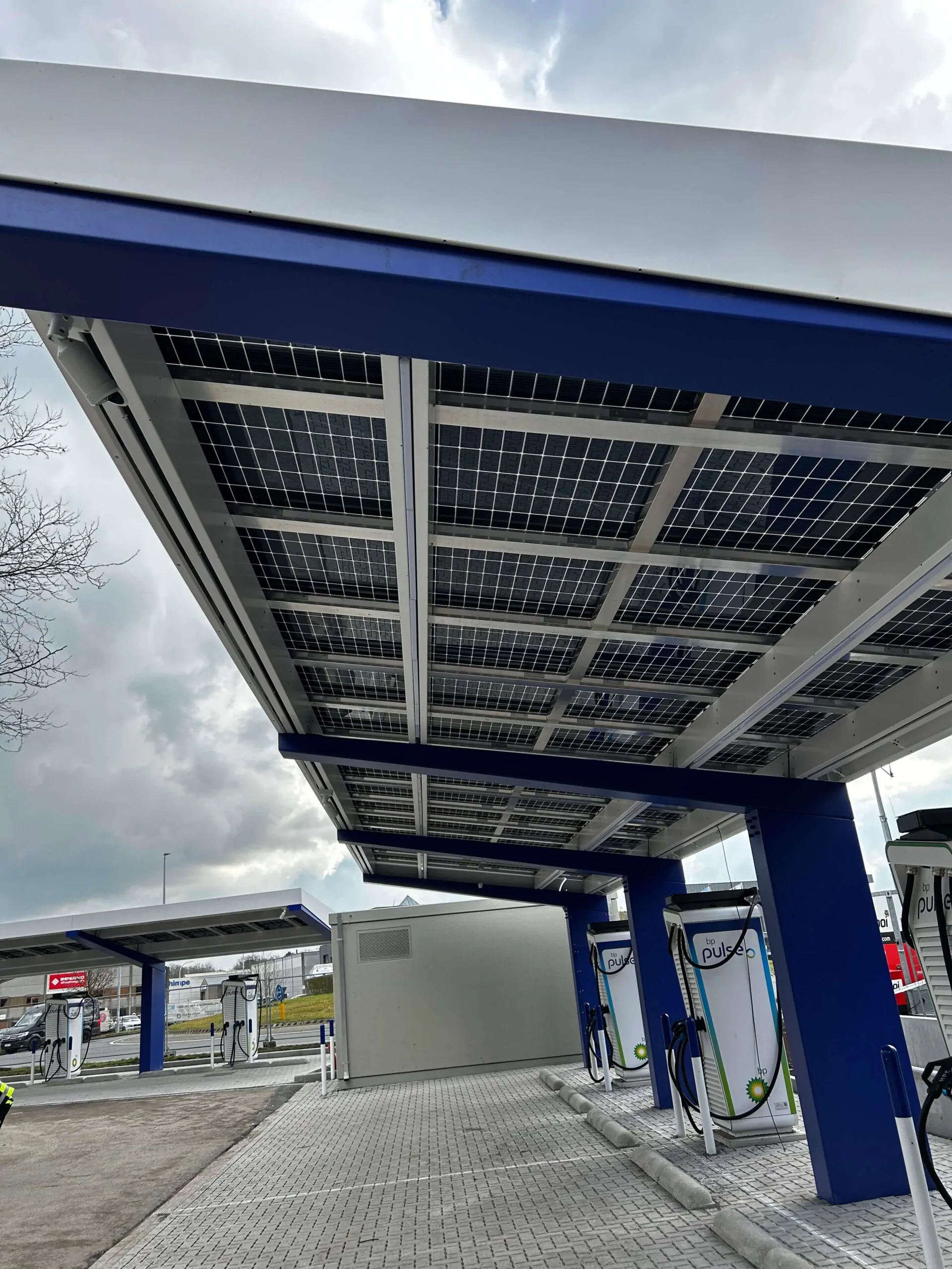Covered forecourt parking with OPTI Bluetop Solar Parking and BlueRoof at BP Loppem